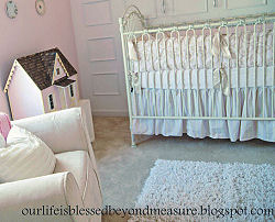 Vintage dollhouse in a pink baby nursery