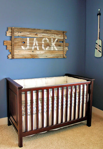 Nautical baby boy nursery with rustic wood sign with Jack's name stenciled in bold letters