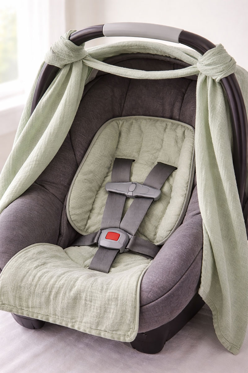 Clear harness and buckle access with removable baby car seat cover