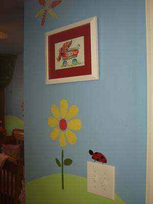 Ladybugs and caterpillars enjoy the flowers and sunshine in our baby girl's nursery.
