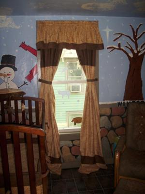 The snowman is just one of the 4 seasons depicted in our nursery wall painting.