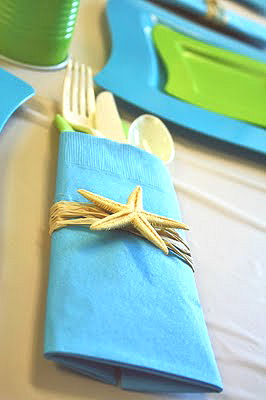 Turquoise blue and lime green napkins and party tableware for a beach theme baby shower