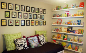 White floating shelves hung from floor to ceiling on a nursery wall