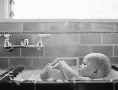 Black and white newborn baby bathtime baby photo shoot