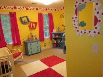 Our baby boy's Dr Seuss nursery with bright yellow walls and red white and blue decorations