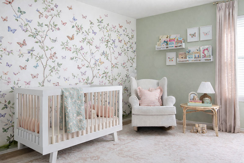Soft pastel butterfly nursery color palette with blush, cream, and light blue decor