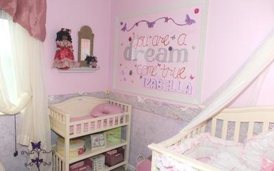 Izabella's beautiful princess nursery room has a wall border hand-painted by her mom.