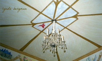 Custom mural painting on the ceiling of a baby nursery room by Lynda Bergman