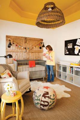 Rustic baby boy nursery room with onesie wall decorations