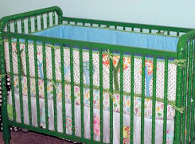 Used secondhand Jenny Lind baby crib painted John Deere tractor green using a DIY painting technique