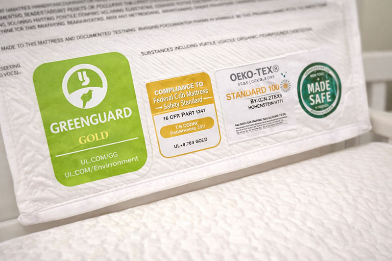 crib mattress certification label showing testing badges