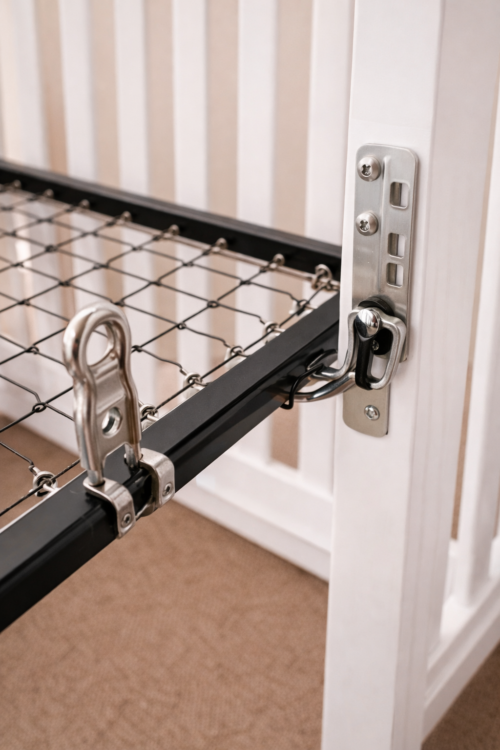 Crib mattress support hangers and metal spring frame brackets attached to crib sides