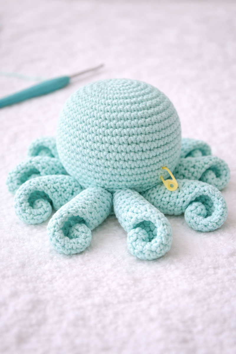 Crochet octopus tentacles curling evenly around the base