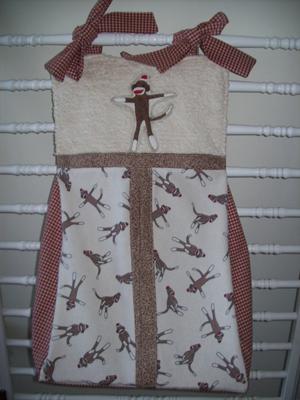 Custom made baby sock monkey diaper stacker and organizer for the nursery