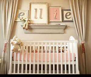 Baby girl nursery room with custom crib canopy drapes in pink and brown