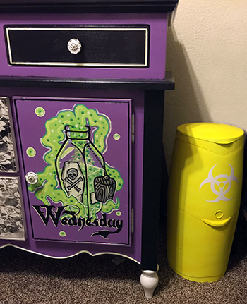 DIY baby Diaper Genie made from a trash can with a bio hazard sticker