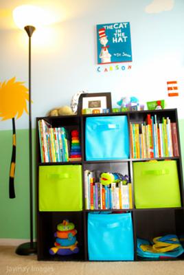 The Dr. Seuss Cat in the Hat painting decorating the wall over our baby's nursery bookshelf.  