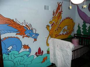 Painting of Chinese purple, red and green dragons on a dragon theme baby nursery wall mural art