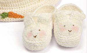 Crochet Easter bunny baby booties with hat and crocheted carrot