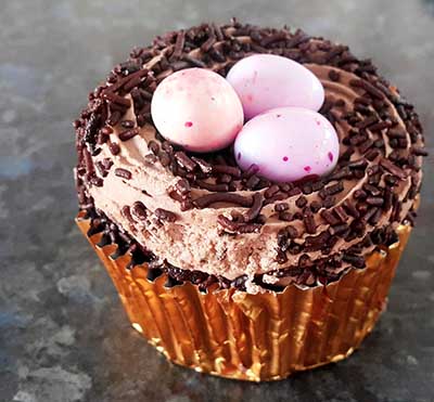 Easy homemade cupcakes for an Easter baby shower with egg nest frosting