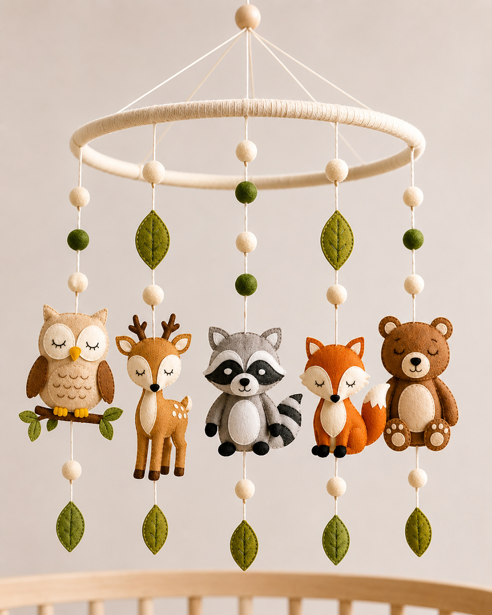Final balancing adjustments for a woodland crib mobile