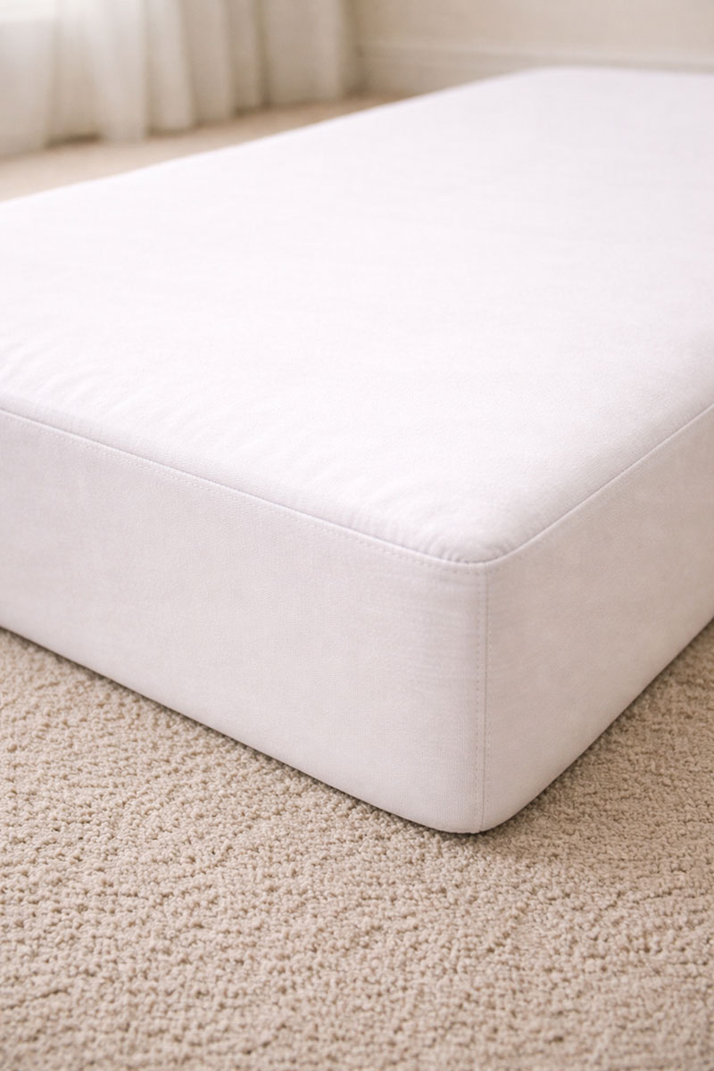 Firm crib mattress corner showing strong edge support