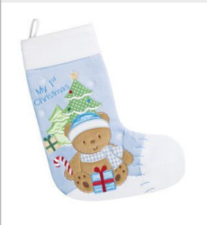 Baby boy first quilted Christmas stocking with an appliqued teddy bear candy canes and presents under the tree