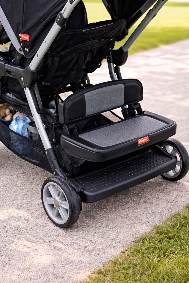Rear standing platform and bench seat layout on a Fisher-Price sit and stand stroller