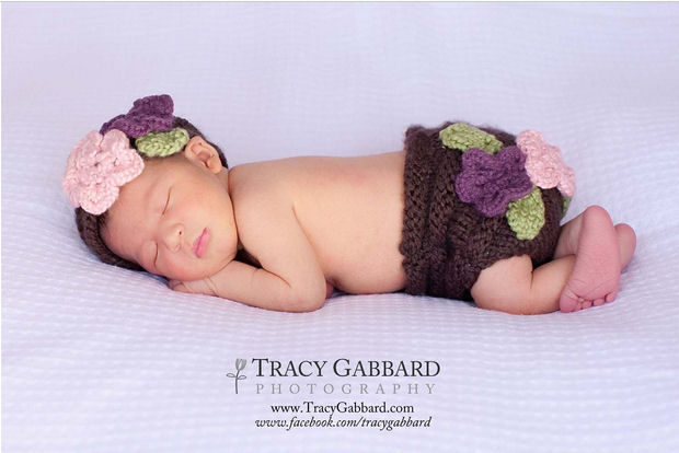 Baby diaper cover knitting pattern with hat decorated with flowers.  Knit diaper cover and hat headband decorated with crocheted floral decorations.