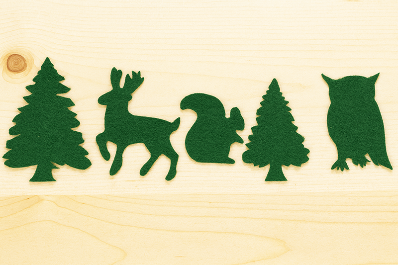 DIY woodland felt animal cutouts including trees, owl, deer and squirrel for nursery crafts
