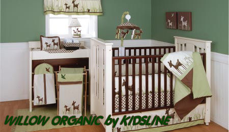 Forest friends deer baby crib bedding set in a green and brown woodland themed baby nursery room