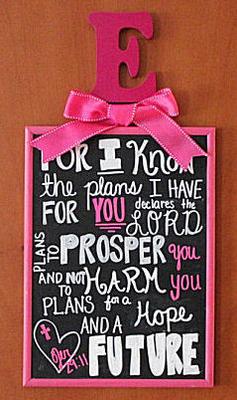A Bible verse, Jeremiah 29:11 For I know the plans  I have for you, declares the Lord, is framed in fuchsia pink with baby Emerson's initial and a girly bow atop the subway style wall art 