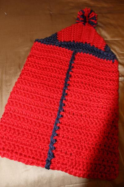 Red and Blue crochet baby bunting for a boy in Ole Miss colors with a pom pom