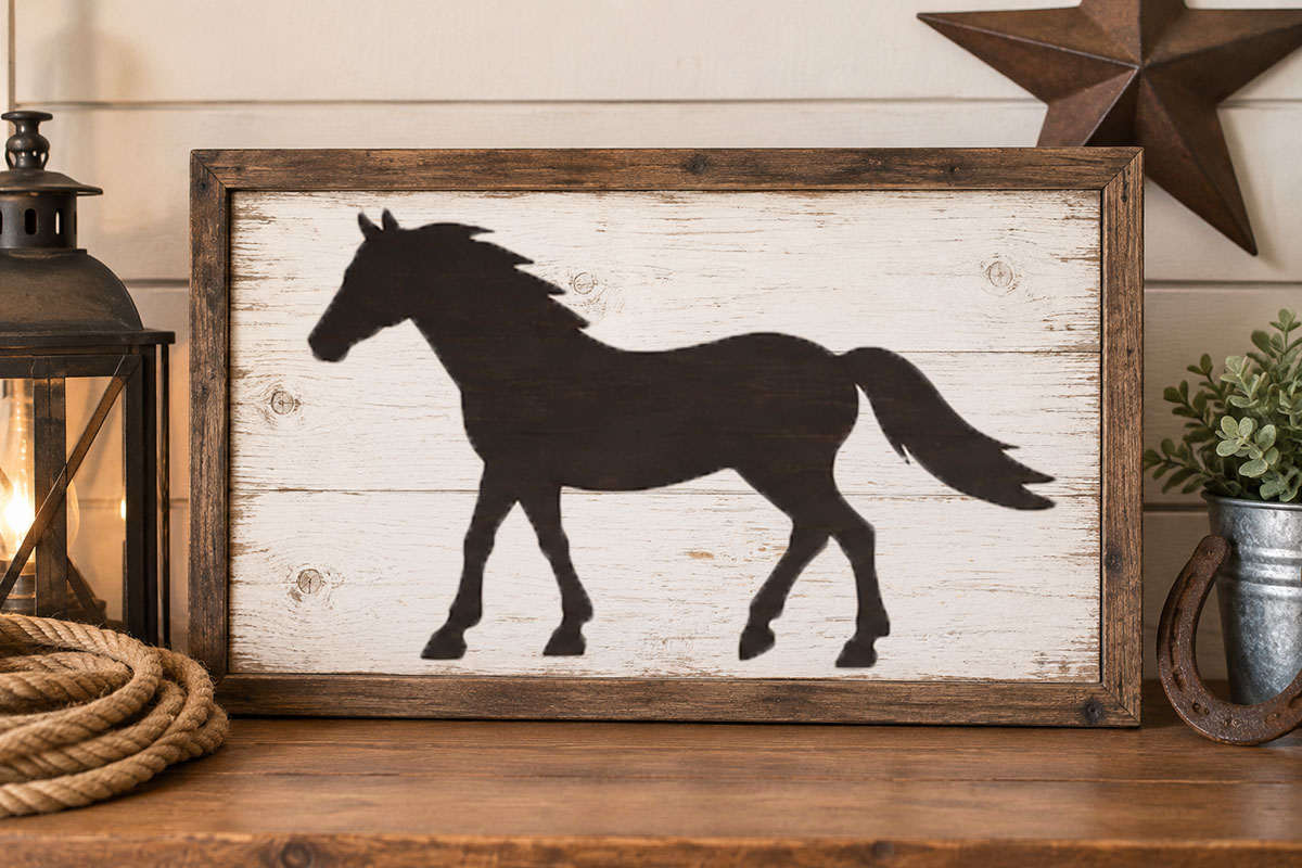 Painted horse stencil on a warm white wooden sign with simple western styling