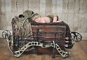 Rustic baby boy bow hunting theme newborn portrait