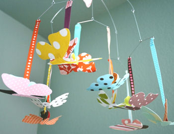 Modern butterfly baby ceiling mobile in a baby girl nursery room