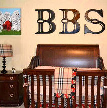 Baby boy sports theme nursery with football decorations and a Burberry plaid crib bedding set