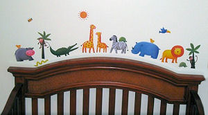 Jungle safari animals and zoo animals with letter decals spelling the baby' name on the nursery wall