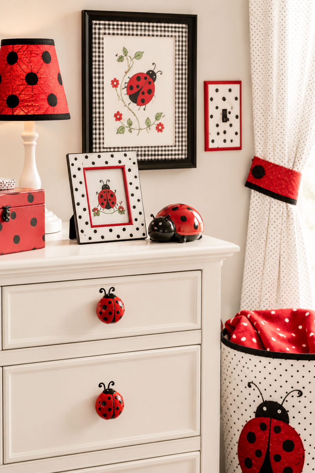 Ladybug nursery accessories with red drawer pulls, framed wall art, switch plate and coordinated baby room decor