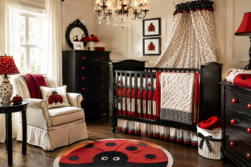 Ladybug nursery accessories with red and black wall art, dresser knobs, storage accents and baby room decor