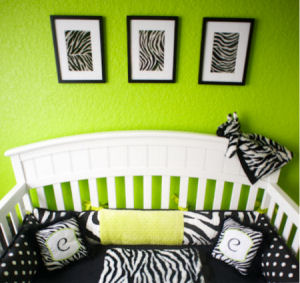 Bright lime green nursery walls with a black crib and custom personalized zebra baby bedding