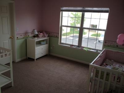 A full view of our baby girl, Makenzey's, bubblegum pink and green ladybug nursery theme