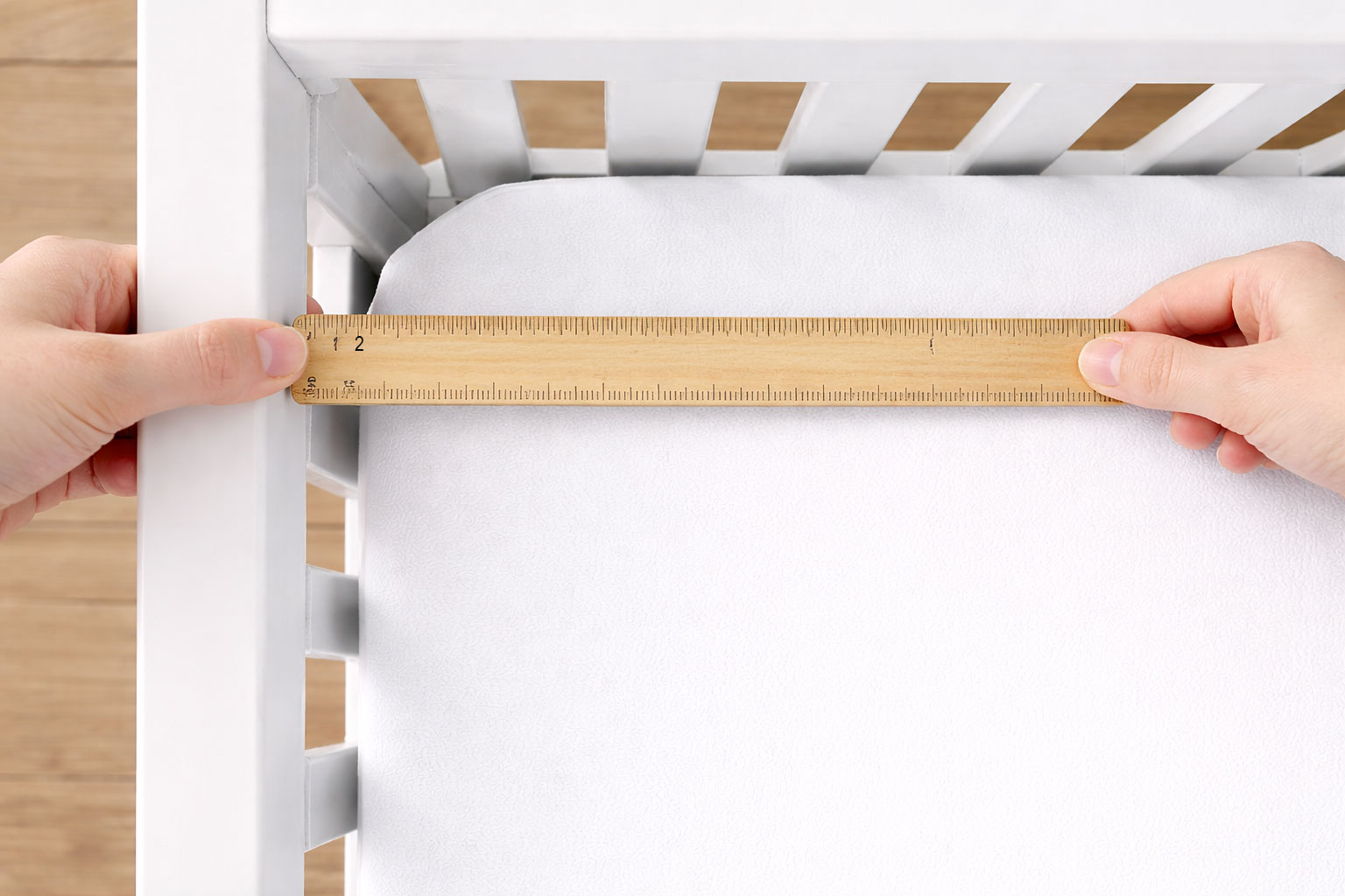 checking gap between mini crib mattress and crib frame for safe fit