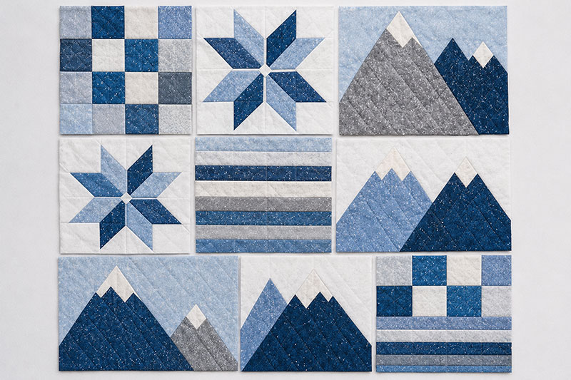 Mountain patchwork quilt blocks arranged before assembly