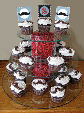Little man mustache baby shower cupcakes decorated with party circles and frosting mustaches