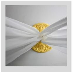 A nursery ceiling medallion painted bright yellow supports a mosquito netting baby crib canopy