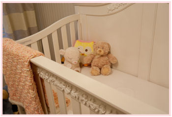 Status Series 200 crib in antique ivory with carved wooden details