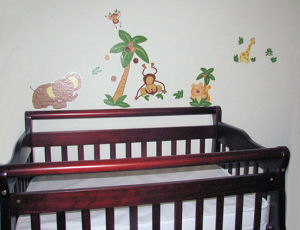 Nojo jungle babies wall decal collection decorating the nursery wall over the crib