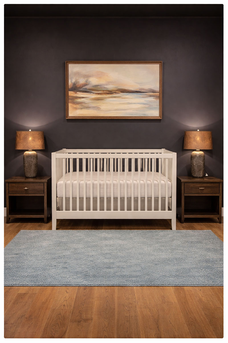 Crib placed on an interior wall with open space around it and no cords or heavy items nearby