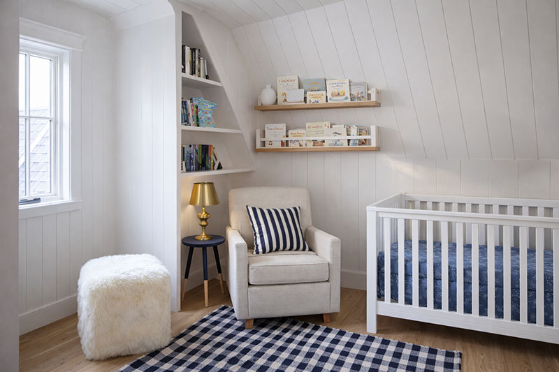 Nursery layout with defined reading corner and floating bookshelves